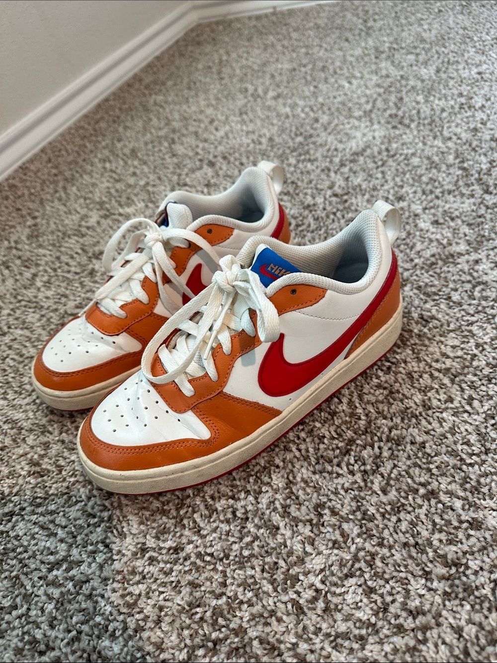 Nike Big Kids Low-Top Sneakers in White, Orange & Red Swoosh